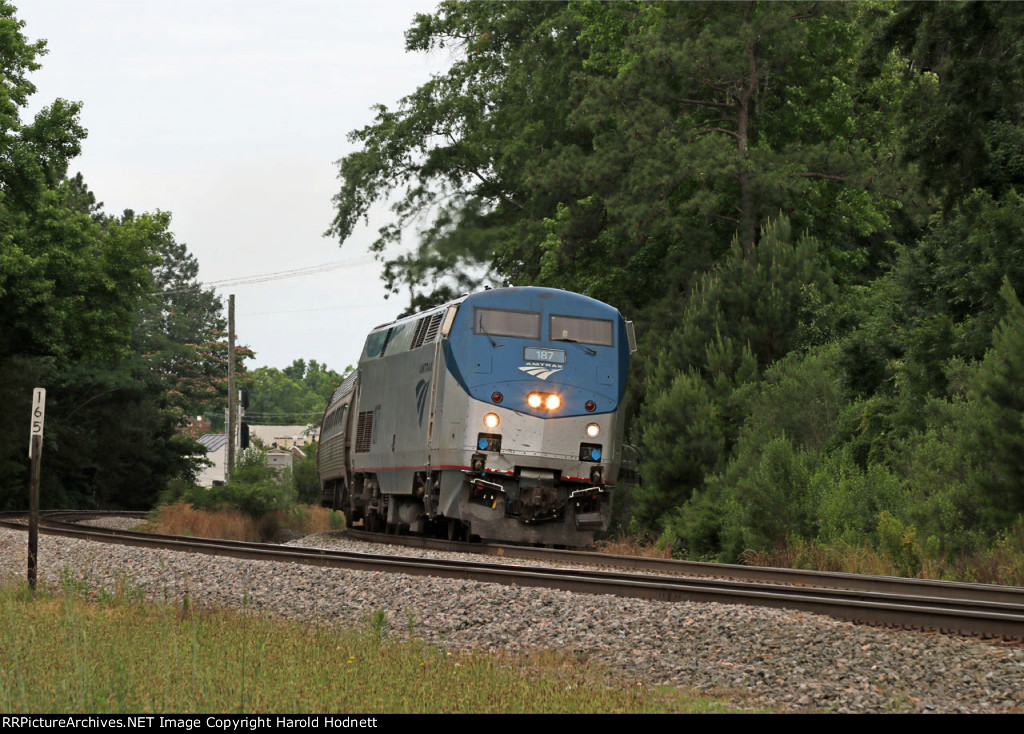 AMTK 187 leads train P080-03 away from the station